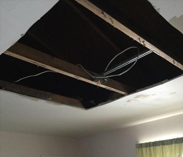 Damage on ceiling and ceiling fan removed