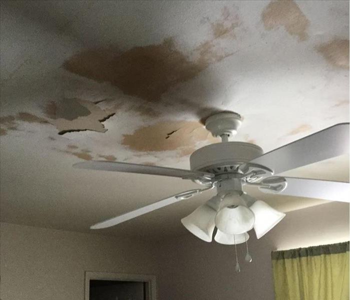 Water damage on ceiling around ceiling fan